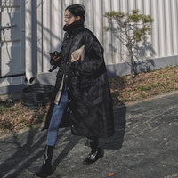 Damen wattierter Longline-Mantel mit hohem Stehkragen und Steppnähten in Schwarz