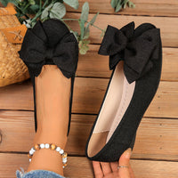 Damen Ballerinas mit XL-Schleifen-Applikation und glänzender Oberflächenstruktur in Schwarz