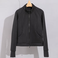 Damen Performance-Trainingsjacke mit Stehkragen und Daumenloch Nord Taschen in Dunkelgraues Oberteil