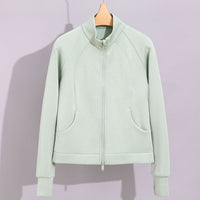 Damen Performance-Trainingsjacke mit Stehkragen und Daumenloch Nord Taschen in Wellengrün Oberteil