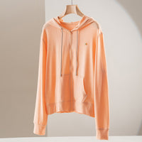 Damen leichte Kapuzen-Sweatjacke aus Slub-Jersey mit durchgehendem Reißverschluss und Kängurutaschen Nord Taschen in Orange