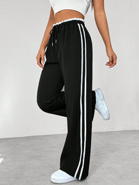 Damen Hose mit Seitenstreifen und elastischem Bund in Schwarz