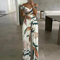 Damen Jumpsuit mit Off-Shoulder-Ausschnitt und Wickeloberteil mit weitem Bein in Weiß mit Tropikaldruck
